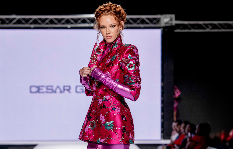 A female model. poses at the end of the runway in new york city designer Cesar Galindo jacket.