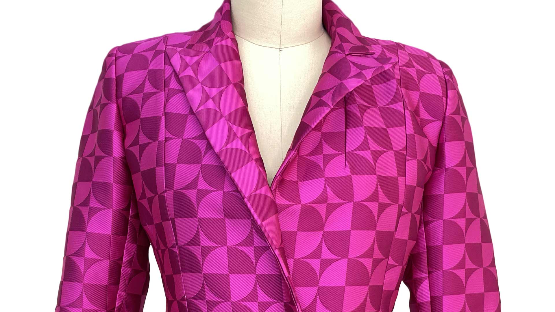 A hot pink blazer on a fashion mannequin.